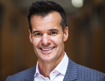 A headshot of Lino Saputo Jr. smiling