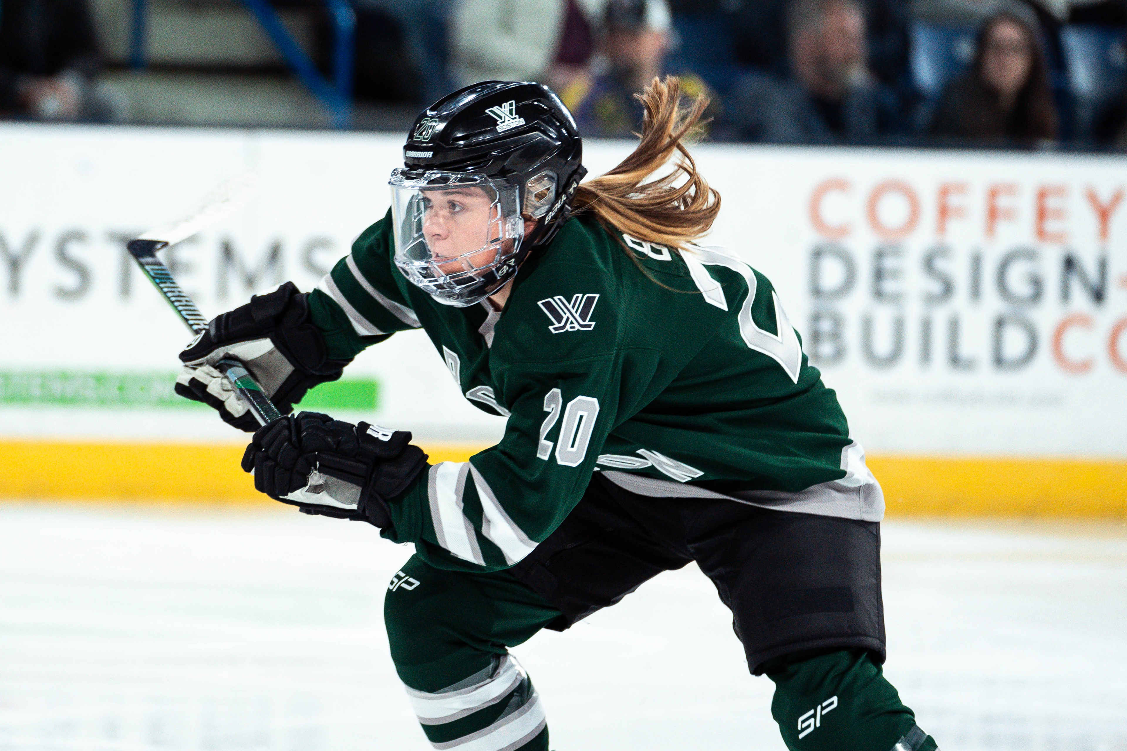 Hannah Brandt skating up the ice in her PWHL Boston jersey