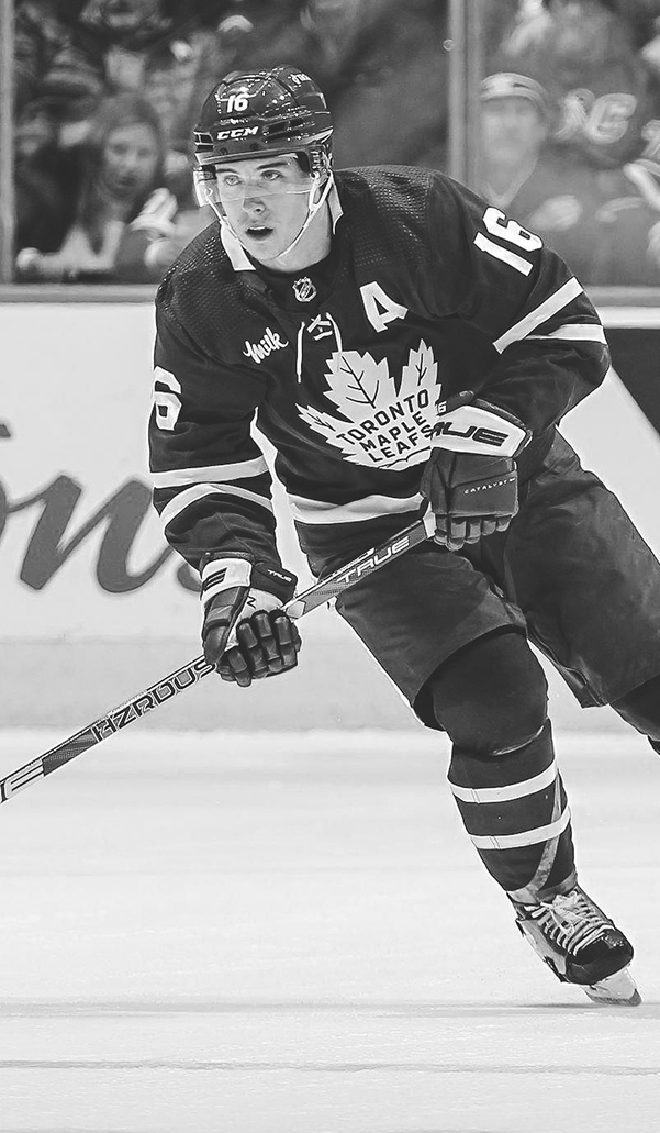 Mitch Marner of the Toronto Maple Leafs skating with the puck.