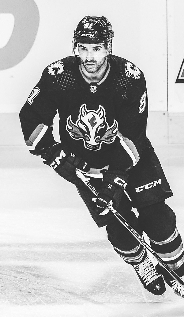 Nazem Kadri of the Calgary Flames skating with the puck.