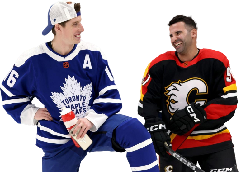 Mitch Marner and Nazem Kadri kneeling and laughing together at the 2023 NHL all-star game.